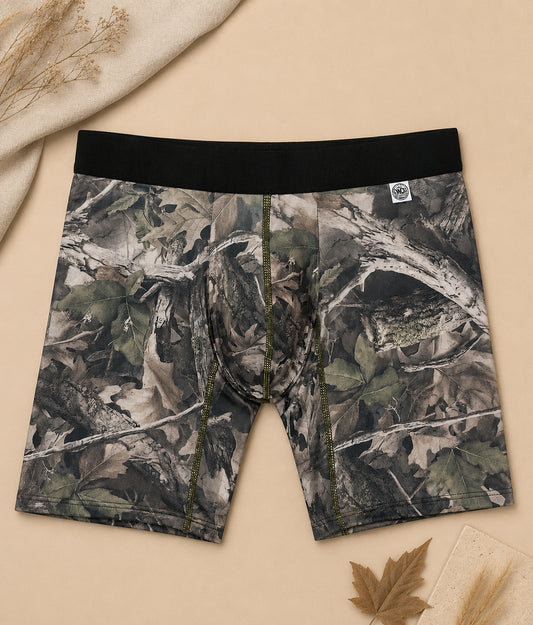 Men's Faded camo hunting boxer brief flat lay on beige backdrop with maple leaf