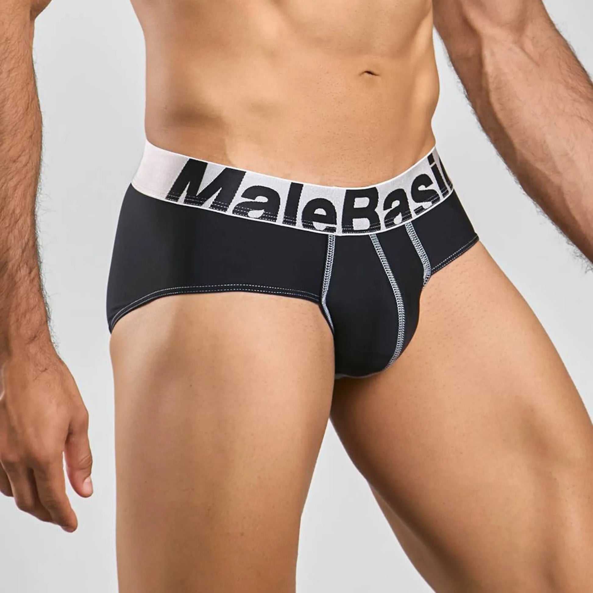 Men's stretch microfiber brief in black, three-quarter side view showing seam detail
