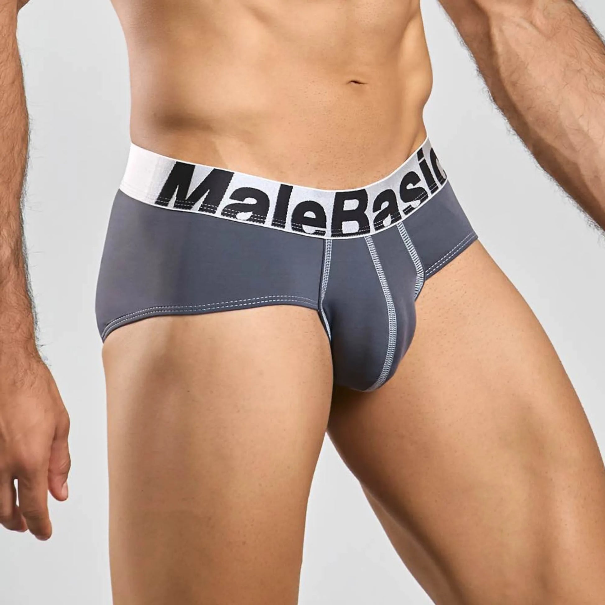 Men's stretch microfiber brief in grey, three-quarter side view showing seam detail