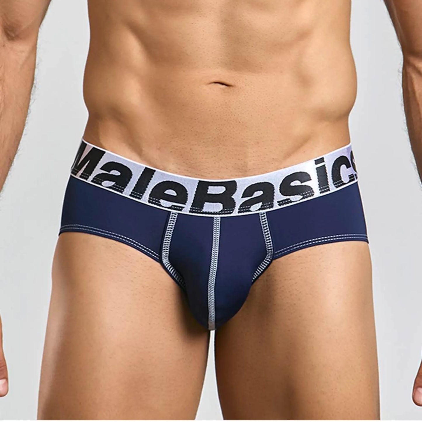 Men's stretch microfiber brief in navy, front view on model