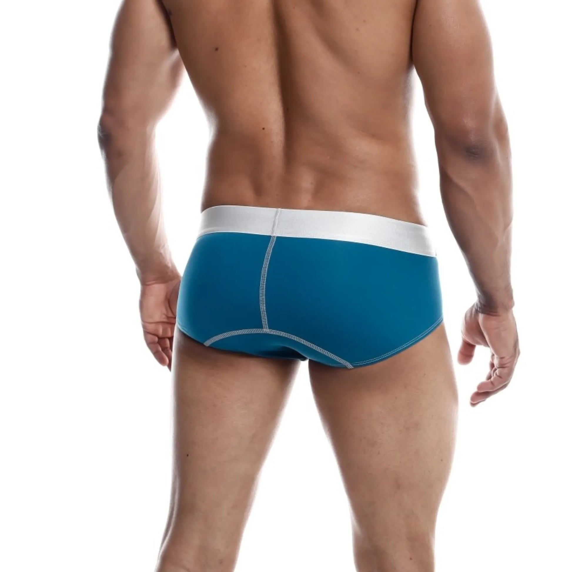 Men's stretch microfiber brief in teal shown full-length on model, back view