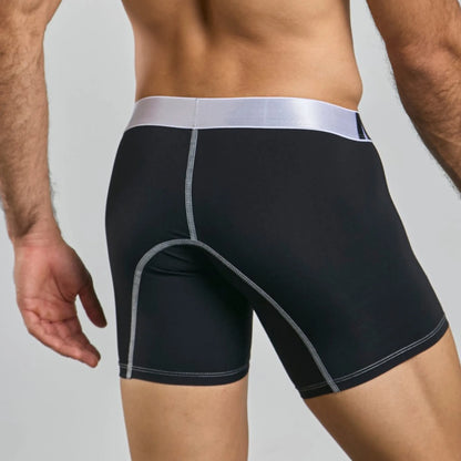Men's mid-leg microfiber boxer brief in black, back view on model