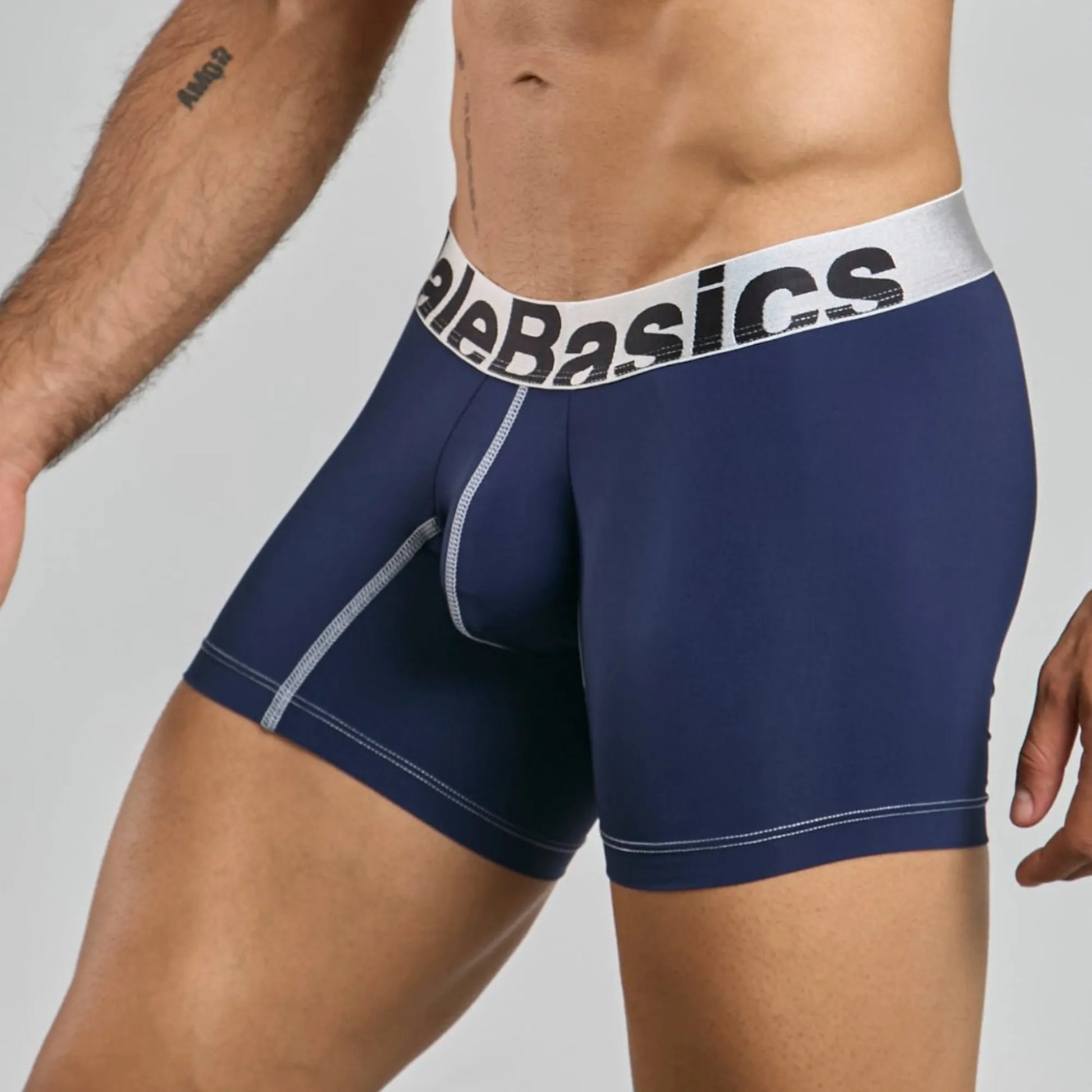 Men's mid-leg microfiber boxer brief in navy, three-quarter side view showing seam detail