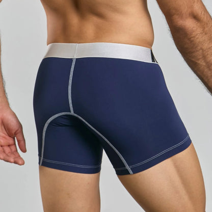 Men's mid-leg microfiber boxer brief in navy, back view on model