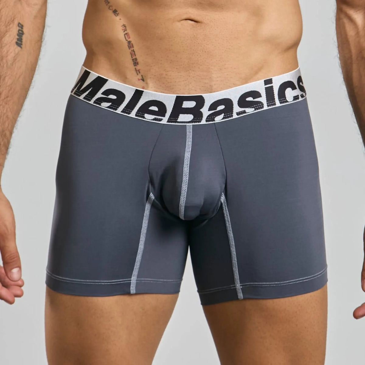 Men's mid-leg microfiber boxer brief in grey, front view on model
