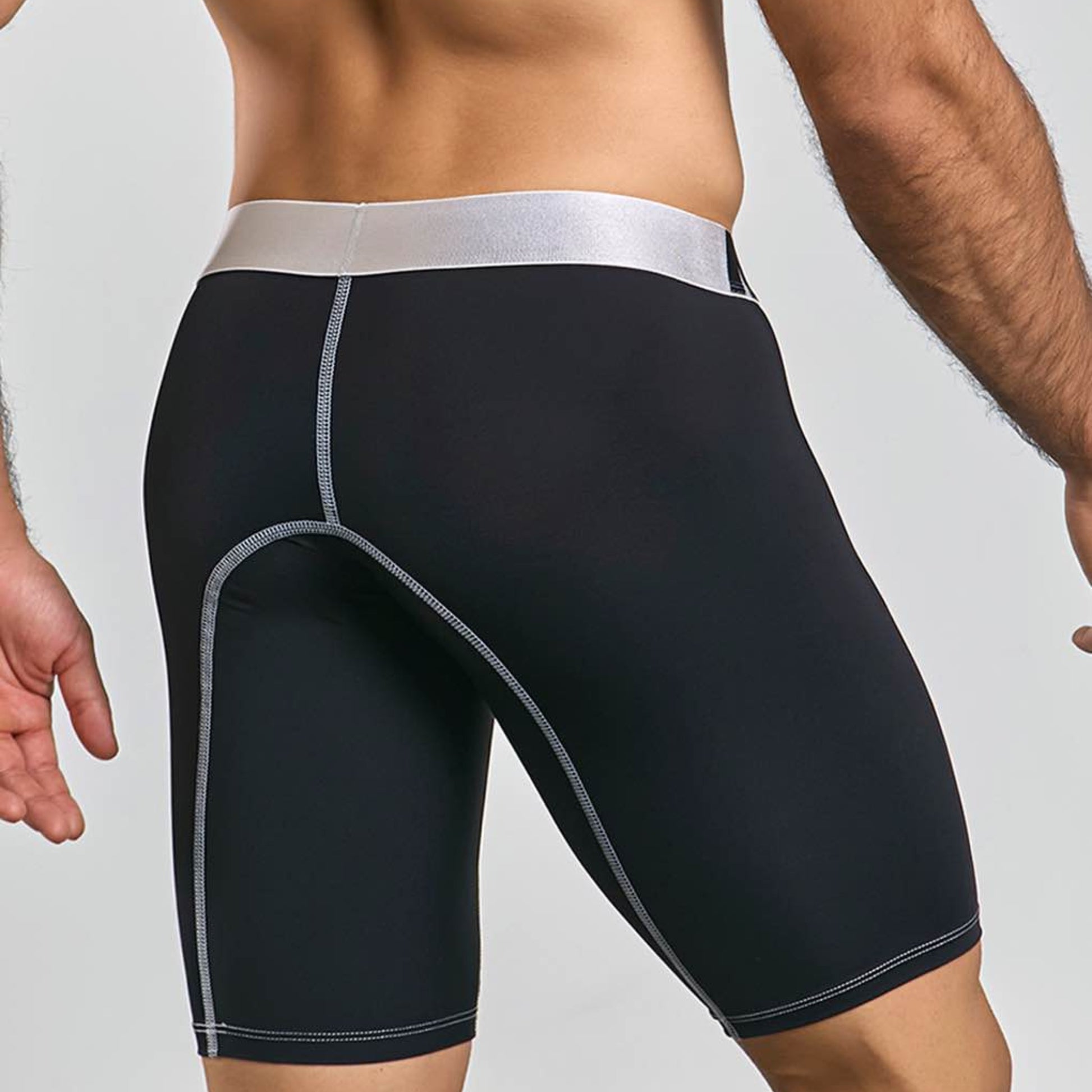 Men's active microfiber athletic boxer in black, back view on model