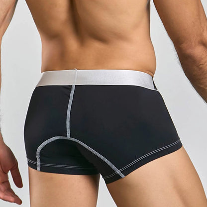 Men's performance microfiber boxer trunk in black, back view on model