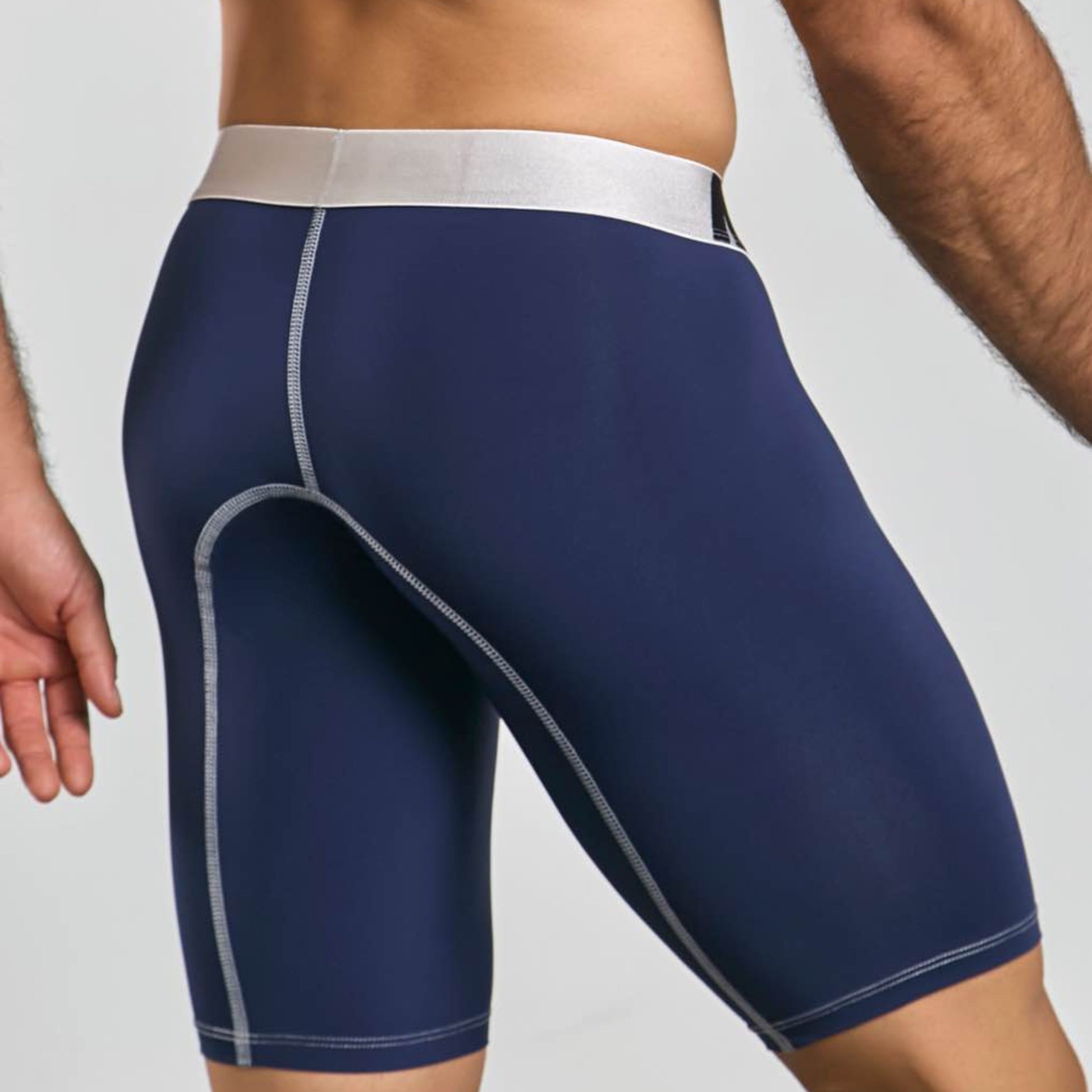 Men's active microfiber athletic boxer in navy, back view on model